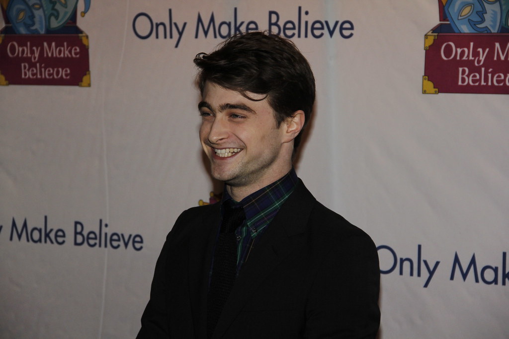 Daniel Radcliffe on the red carpet smiling